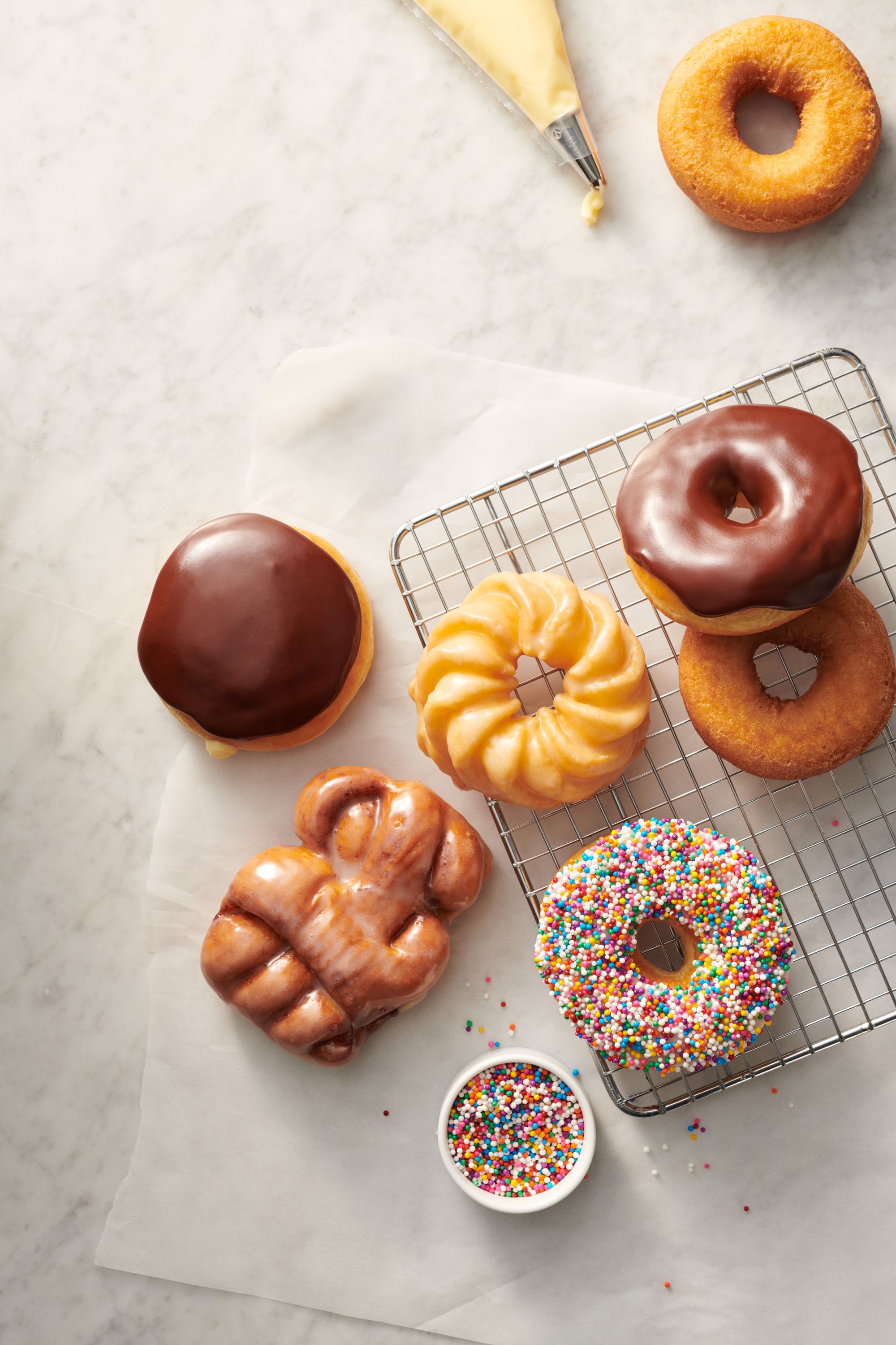 Tim Hortons relaunches two of Canada's favourite donuts! Introducing the  new Apple Fritter and Boston Cream, with over 40% more apples and over 33%  more filling